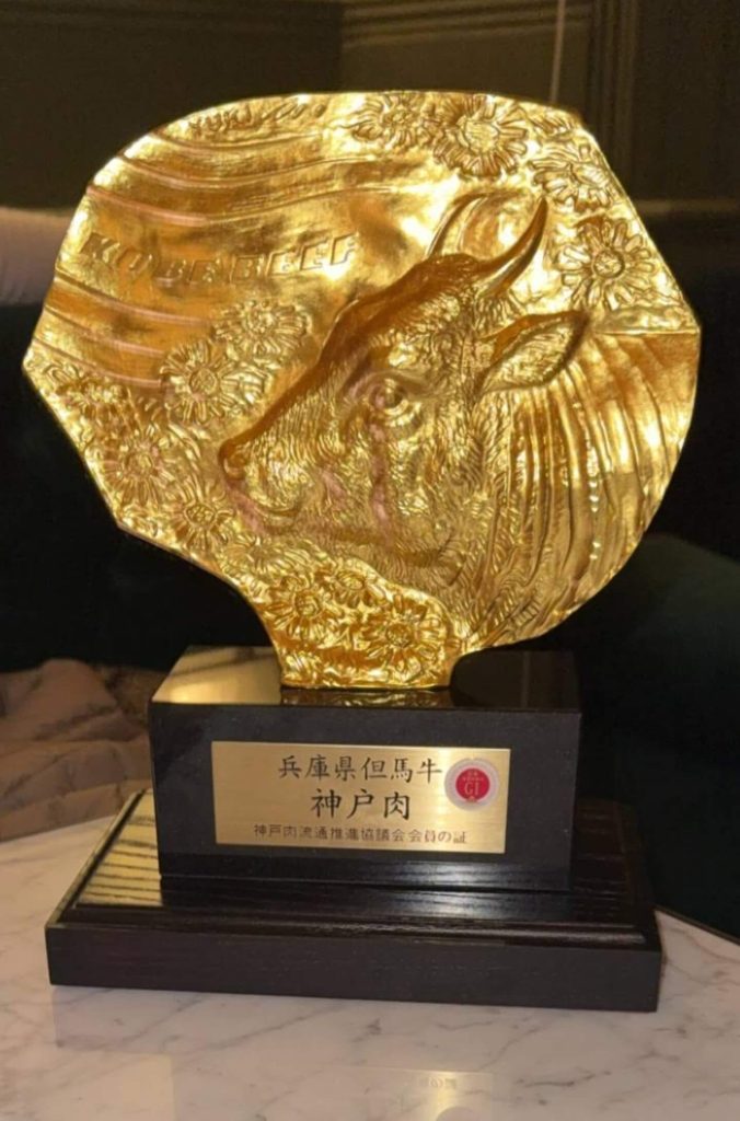 The official Bronze Golden Calf Kobe Beef certification trophy on display at Aki, a Kobe beef restaurant in London.