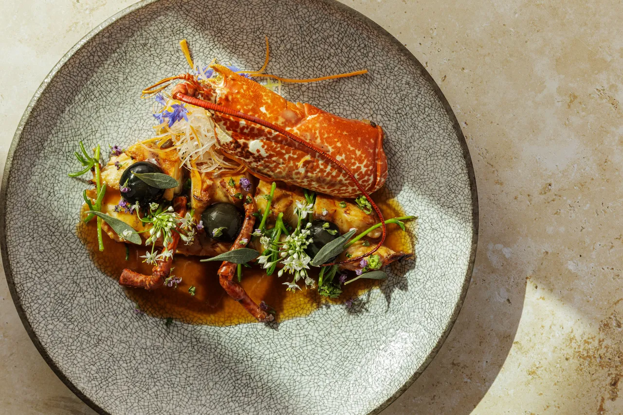Robata grill at Aki London, Canadian lobster enrobed in Kobe fat over binchotan charcoal, a signature dish in Marylebone