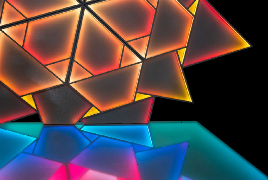 Origami Sunrise (2025). Programmable light sculpture with custom LED system and reflective surface. Courtesy of the artist.
