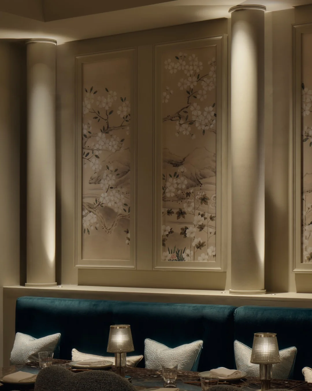 Hand-painted walls and marble-topped tables in The Atrium dining room at Aki London — elegant interior decoration for private terrace hire events