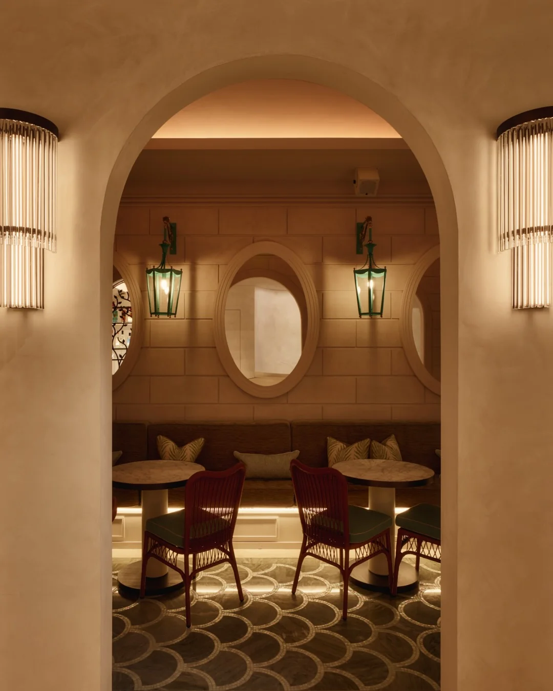 Private terrace with retractable glass roof at Aki London — intimate al fresco dining for up to 12 guests, framed by mirrors and ambient lighting